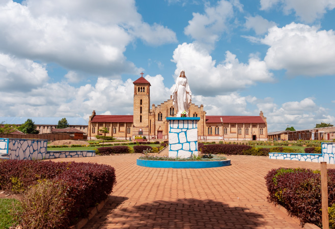 The statue of Virgin Mary in front of catholic cathedral of Huye