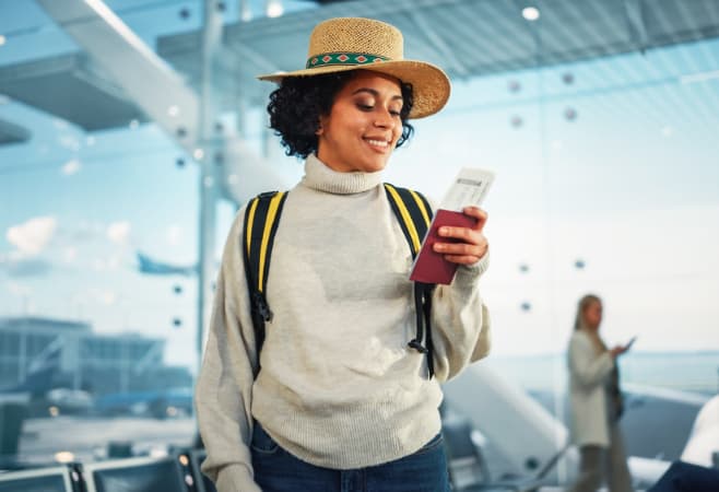 A happy traveling woman with a Rwanda visa was prepared before the trip
