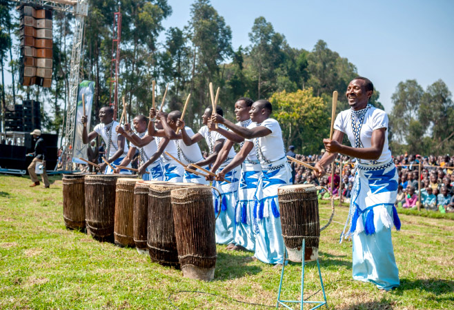Performers are playing Rwandan traditional instruments